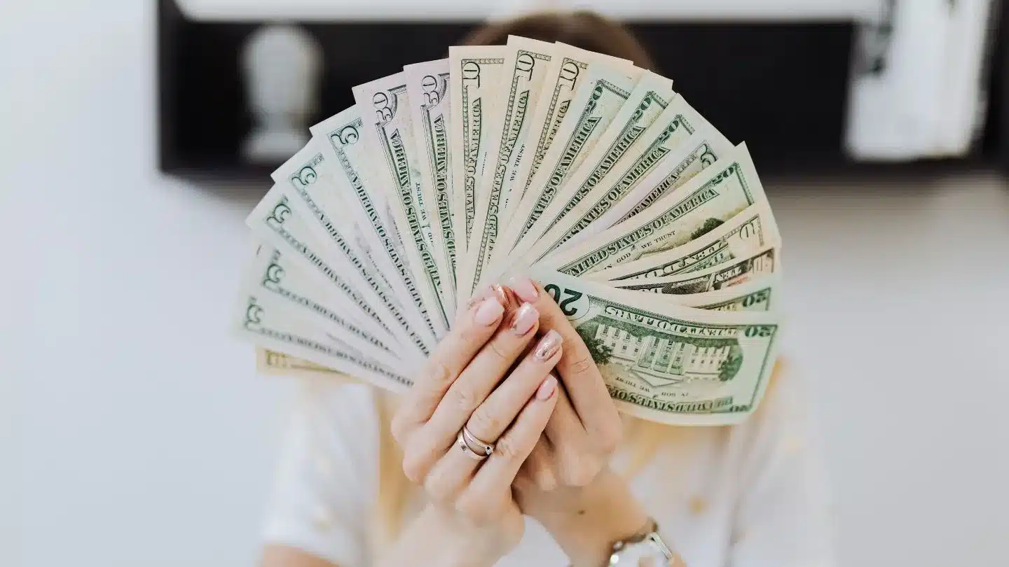 Person Holding US Dollar Bills