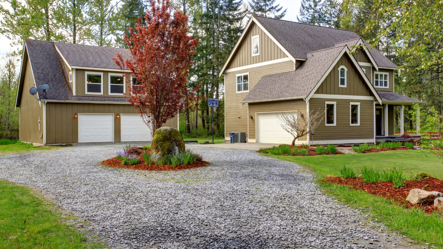 Residential Gravel Driveway With Decorative Landscape Design