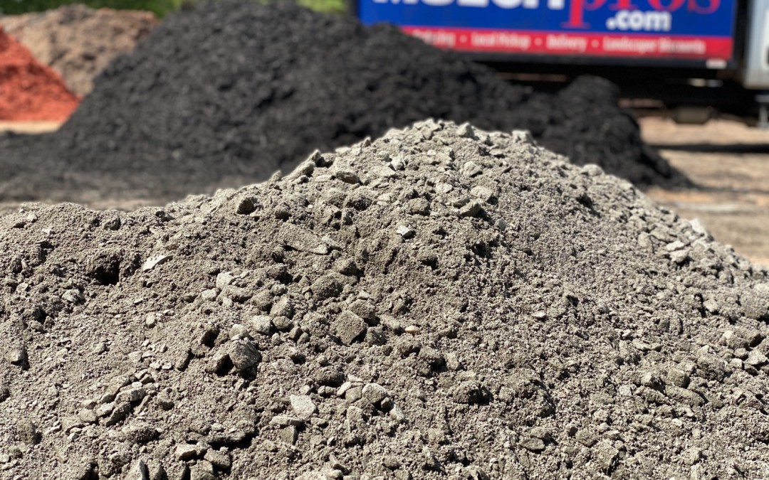 Crusher run gravel pile delivered by the MulchPros tandem truck